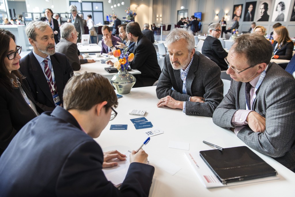 Some very recognisable conference delegates discussing TDM at the FutureTDM Open Science café, CC BY NL2016EU